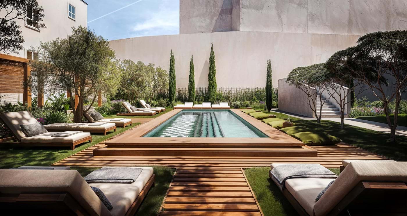 The courtyard swimming pool at Locke de Santa Joana, surrounded by the restored convent walls.