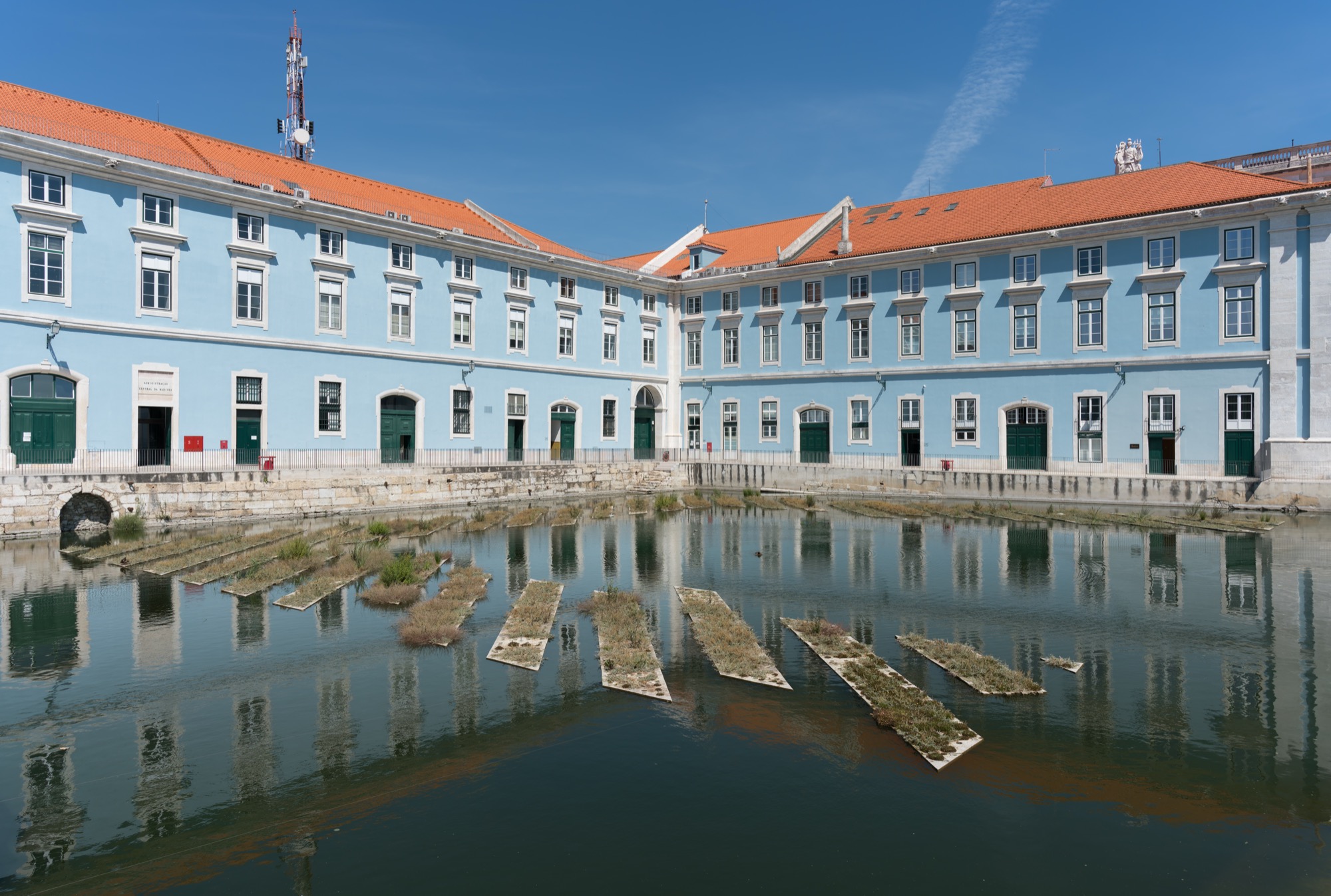The Caldeirinha dock and old Navy Arsenal in Cais do Sodré, Lisbon — the historic waterfront district Outsite sits in.