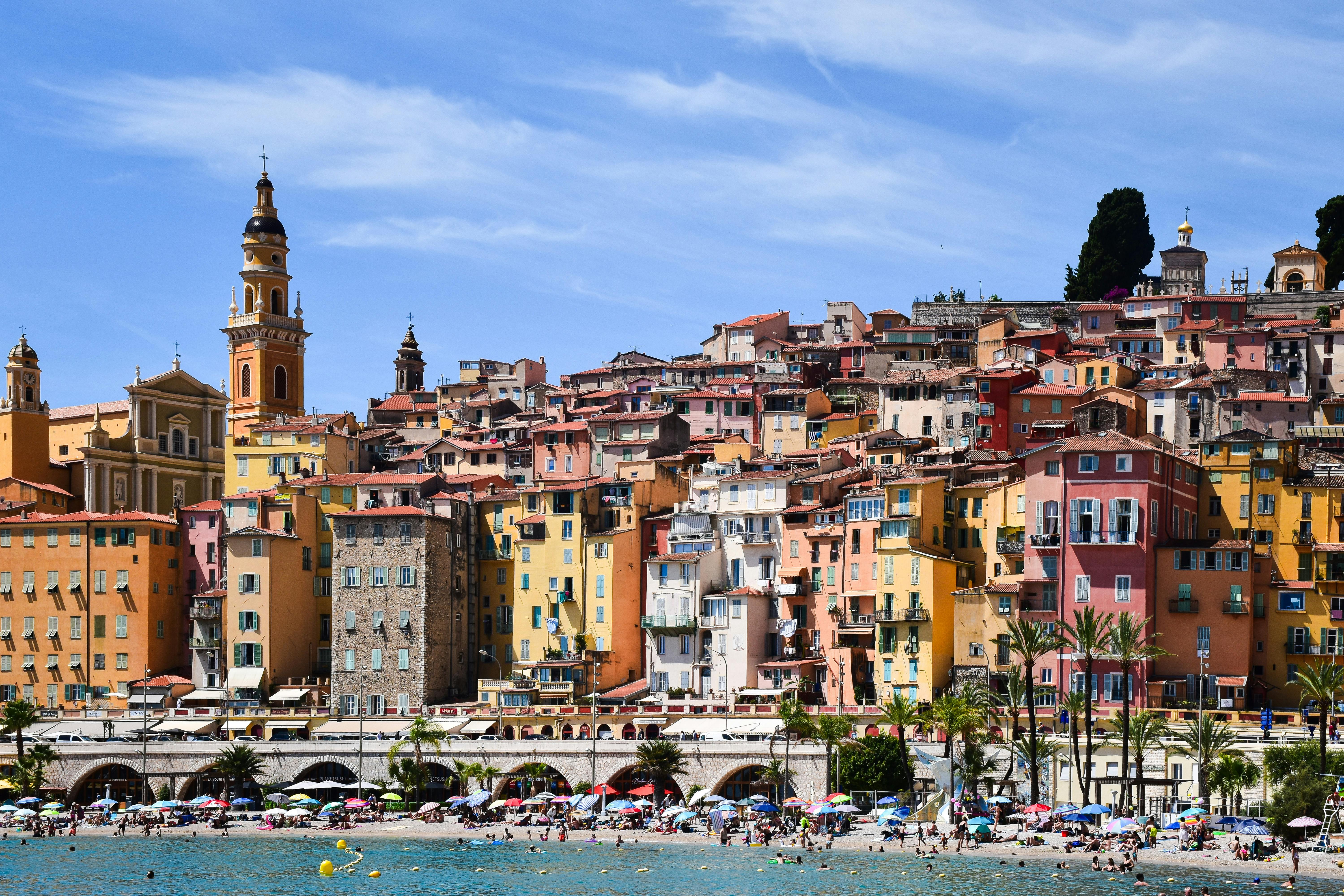 The colorful Belle Époque facades of Menton on the easternmost edge of the Côte d'Azur, with warm Mediterranean light.
