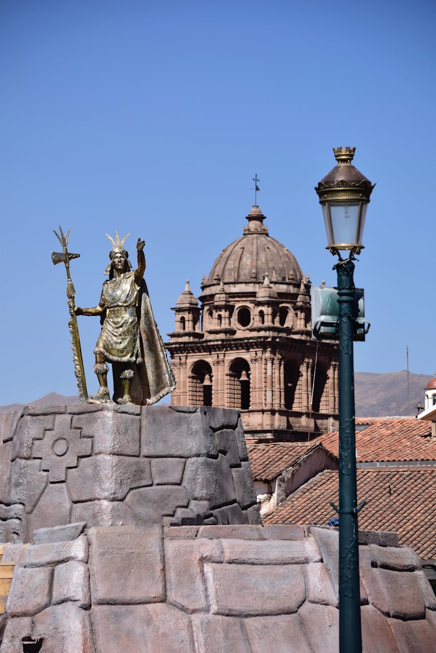 Cusco's Plaza de Armas with Spanish-colonial architecture and Andean mountains beyond — the topography that anchors most Sacred Valley itineraries.