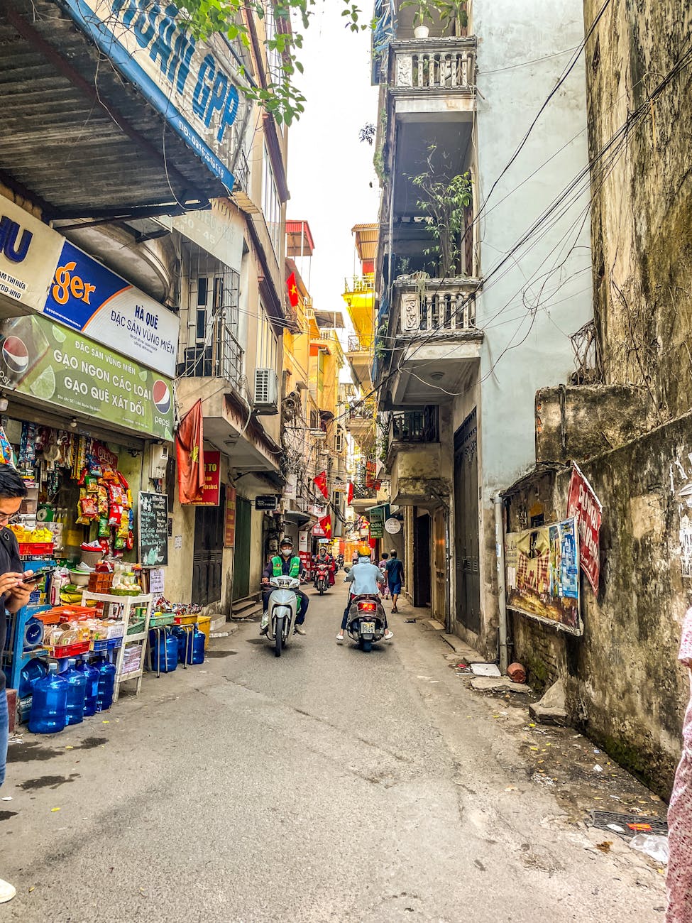 Hanoi street scene — the dense urban texture that defines the Old Quarter and frames a slow-travel stay.