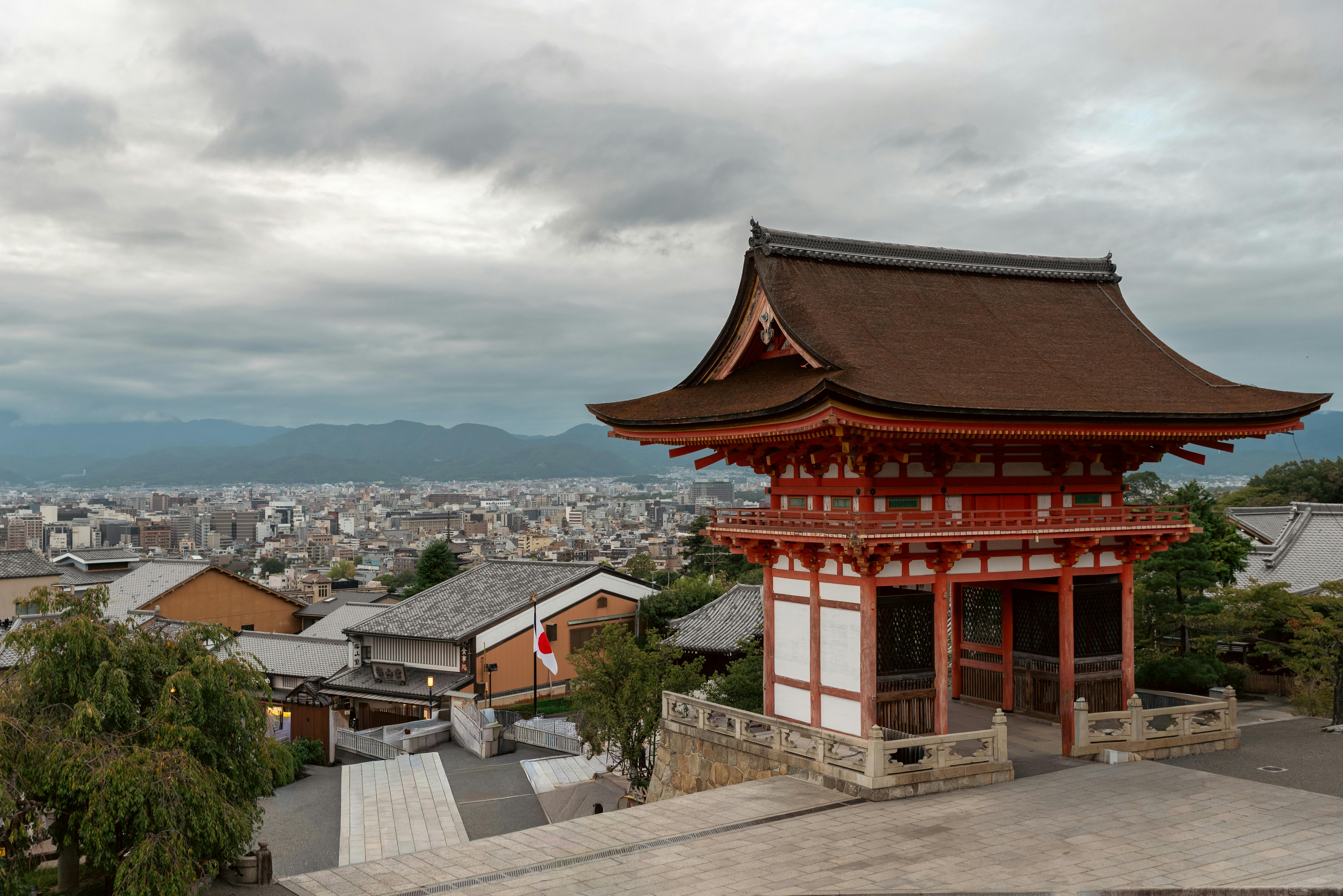 A Kyoto streetscape — the historic-quarter scale that makes a multi-night machiya or ryokan stay decisive for slow-travel experience.
