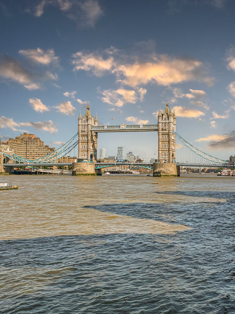 Tower Bridge across the Thames at golden hour — the river view that anchors most of central London's design-forward stay options.