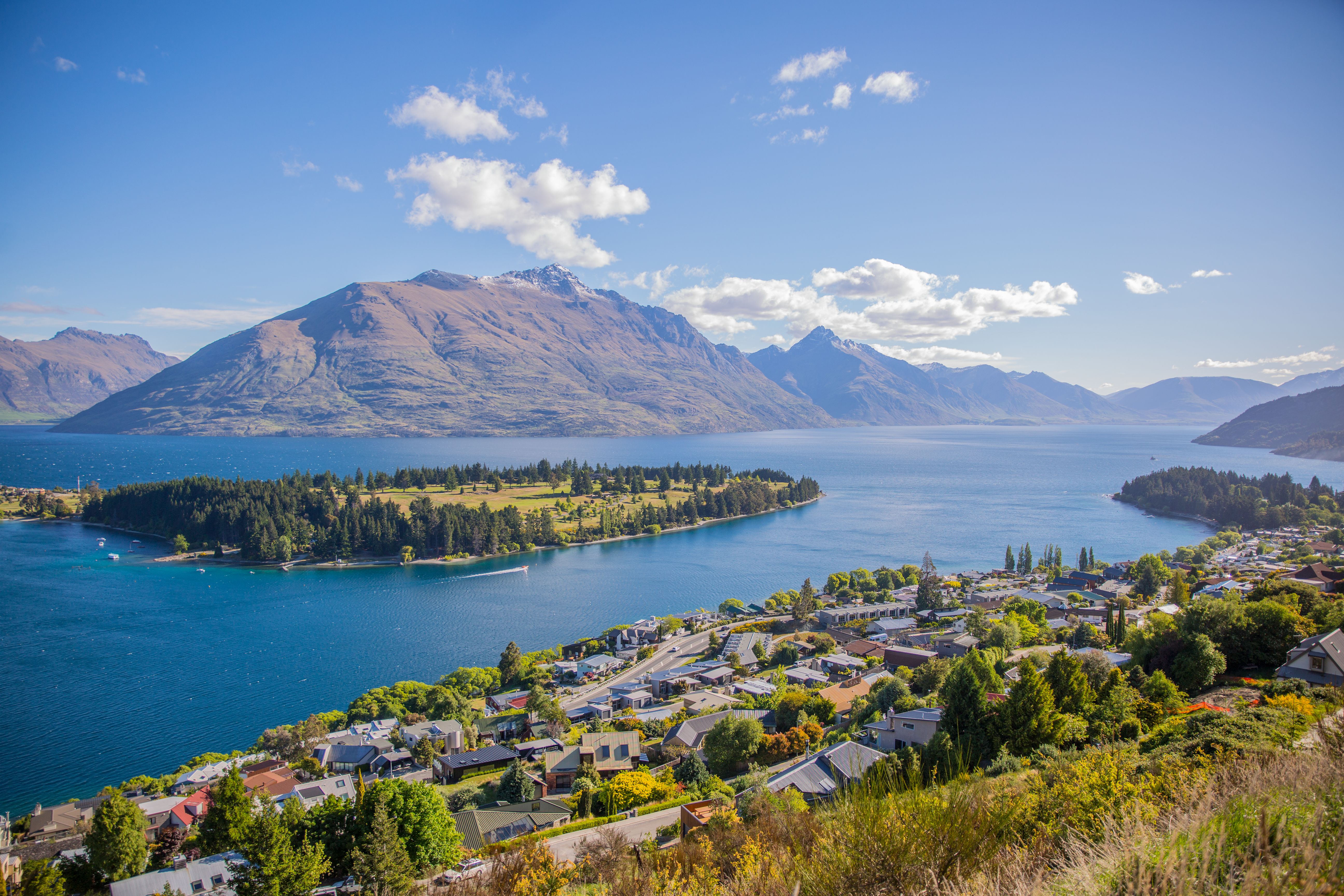 Queenstown's Lake Wakatipu and The Remarkables seen from the hillside above town — the launching pad for the South Island's most-photographed day trips.