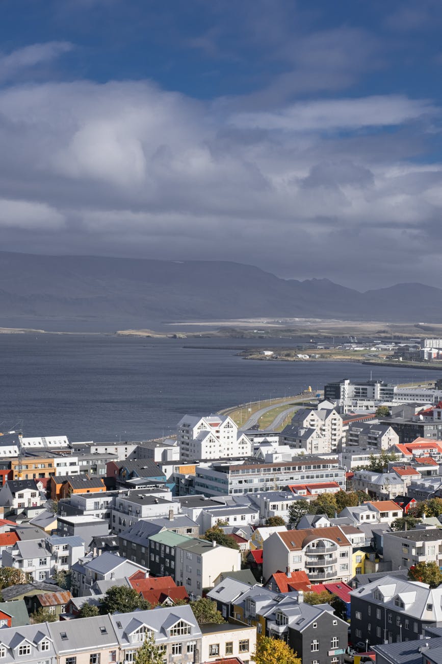 Reykjavik's painted harbour-front houses with the city's pastel facades — the small-scale density that makes a slow-travel stay walkable end-to-end.