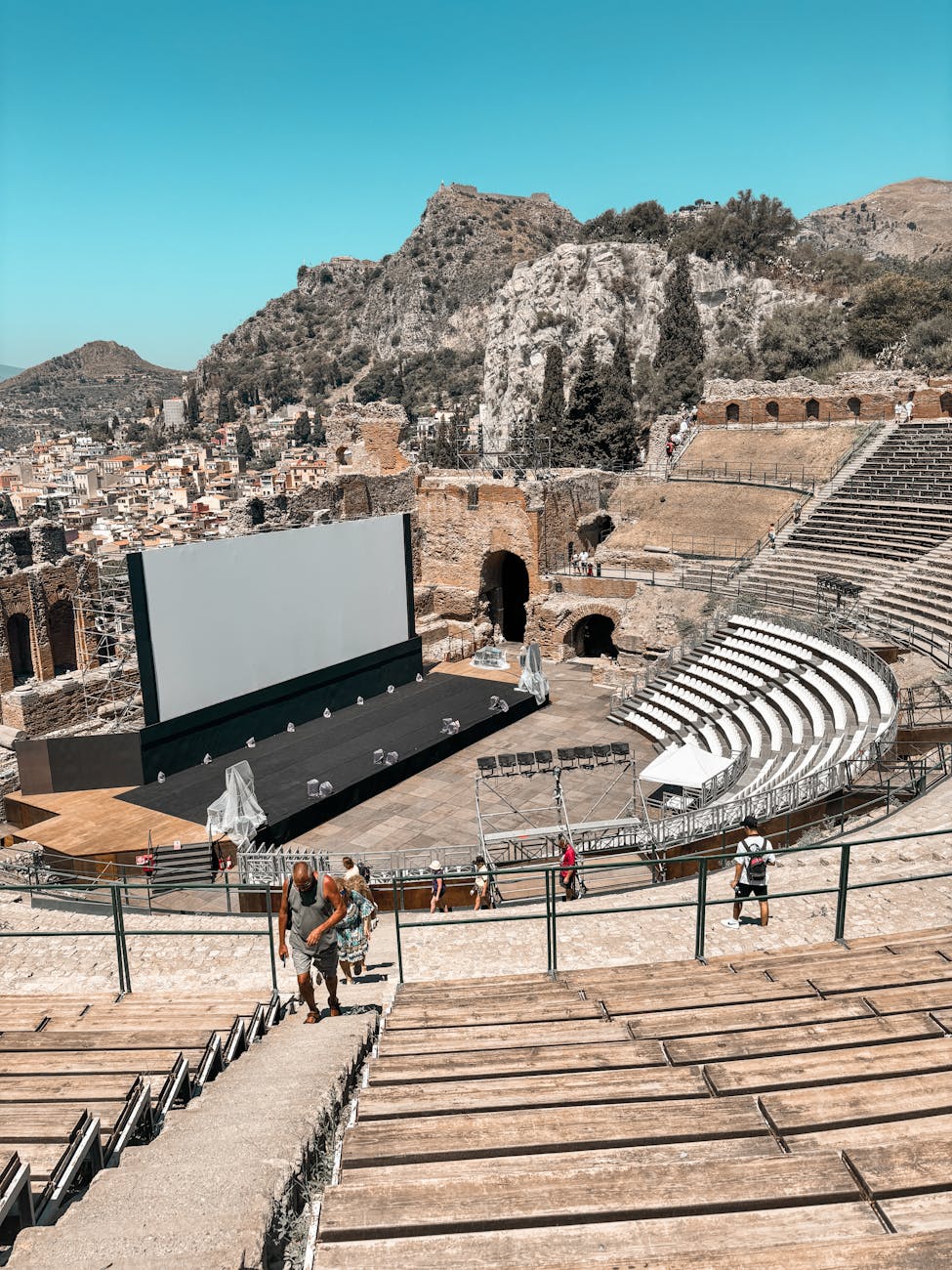Taormina's cliff-edge coast with the Ionian Sea below — the topography that anchors most Sicilian slow-travel stays on the eastern coast.
